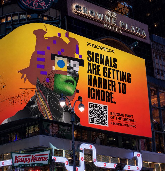 A large illuminated billboard outside Crowne Plaza Hotel displays an ad for 'R3ORDR' with the text 'SIGNALS ARE GETTING HARDER TO IGNORE.' and a QR code.