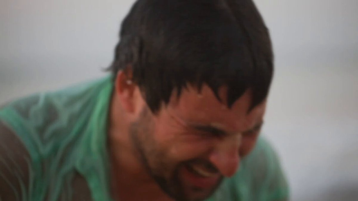 The image features a man with short hair wearing a green shirt, who appears to be laughing or smiling at something. The background of the photo shows an ocean view, suggesting that they might be near the beach. The caption "Late night infomercials just hit different $PNDC $PORK $wPOND" is related to the image and could possibly be a reference to a popular late-night TV show or commercial featuring seafood products.