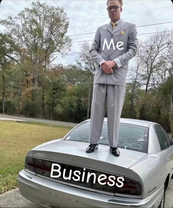 Meme image showing a man in a gray suit standing on the trunk of a Buick car, labeled 'Me' on his face and 'Business' on the car.