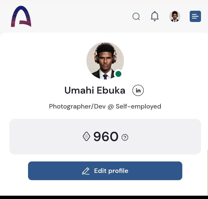 A profile page screenshot showing user 'Umahi Ebuka' described as 'Photographer/Dev @ Self-employed' with 960 points displayed alongside an Edit profile button.