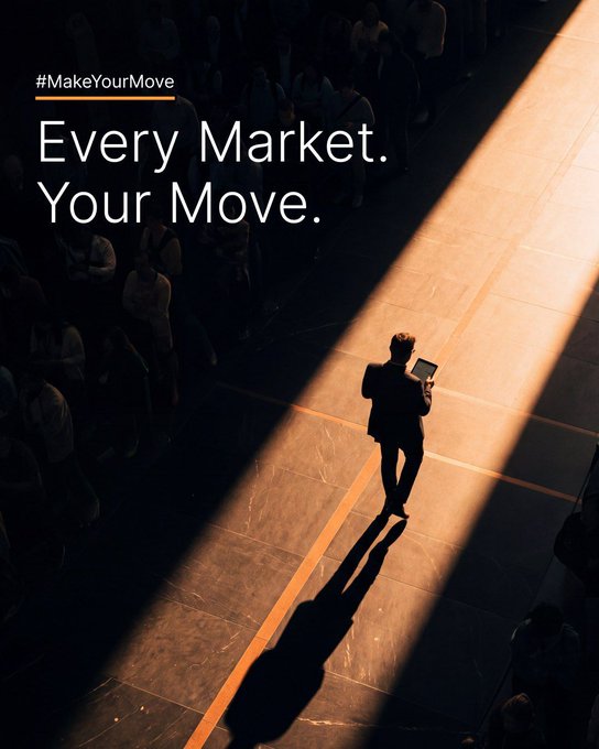A moody photograph of a lone businessman standing in a spotlight, contrasting with a surrounding crowd in shadow, with text reading "#MakeYourMove Every Market. Your Move."