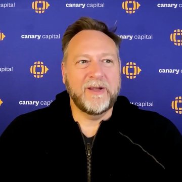 The image features a man wearing a black jacket, standing against a blue background with a white logo that reads "CANARY CAPITAL". The man appears to be talking or giving a speech, possibly at an event related to cryptocurrency. The text on the image suggests that he is discussing the potential of Bitcoin as the most famous crypto currency after Bitcoin.

The post also mentions that the CEO of CANARY Capital has said that Bitcoin is probably the most famous crypto currency. This implies that the man in the image might be addressing a topic related to Bitcoin or cryptocurrency, possibly at an event where such discussions are held.