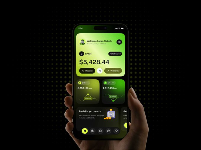 A hand holding a smartphone displaying a green-themed fintech app with 'Welcome home, Satoshi', a cash balance of '$5,428.44', and holdings of 'BTC' (8,059.198 sats) and 'ETH' (2,312.406 sats).
