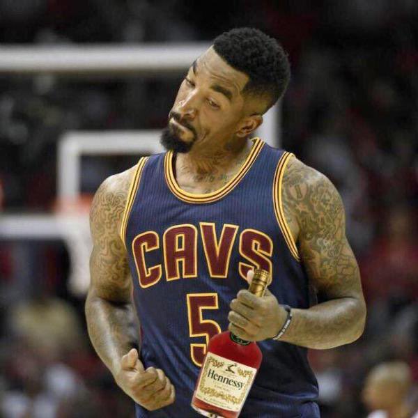 A digitally edited image shows a basketball player in a Cleveland Cavaliers #5 jersey holding a bottle of Hennessy cognac on the court.