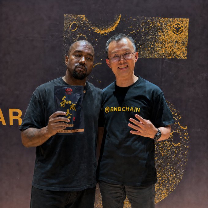 Kanye West and a man wearing a 'BNB CHAIN' shirt pose together; Kanye holds what appears to be a MoonPay-branded package.