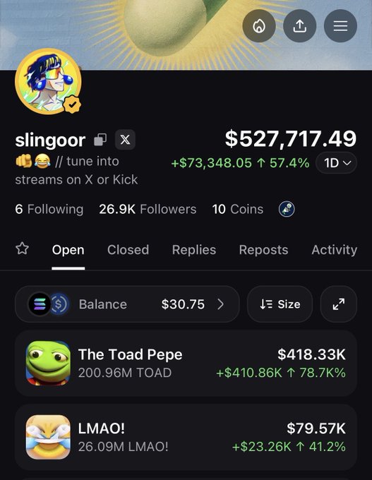 A mobile screenshot of the slingoor profile on what appears to be a meme coin trading platform, showing a portfolio balance of $527,717.49 (+57.4%) that includes holdings in "The Toad Pepe" ($418.33K) and "LMAO!" ($79.57K), with the user's caption humorously noting they trust PoorGoat with such a large bag despite joking about it going to zero.
