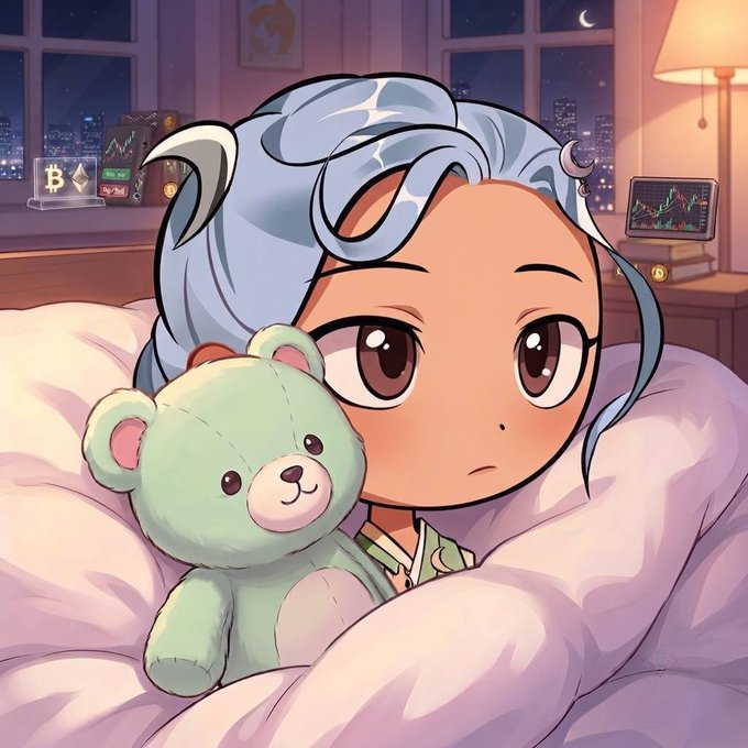 An anime-style illustration of a character with blue hair hugging a small green teddy bear in bed at night, with Bitcoin symbols and a trading chart on a screen in the background.