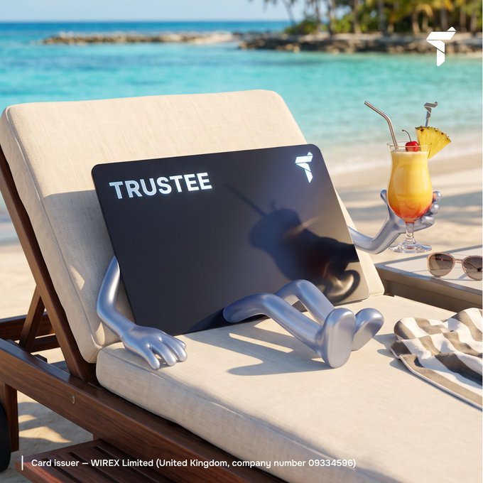 3D rendered advertisement showing an anthropomorphized black 'TRUSTEE' card lounging on a beach chair with a tropical drink, issued by WIREX Limited (UK, company number 09334596).