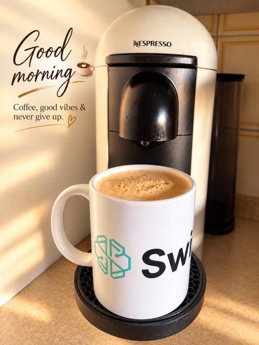 A Nespresso coffee machine brews a fresh cup of coffee into a white mug with a green logo, accompanied by the text 'Good morning - Coffee, good vibes & never give up.'