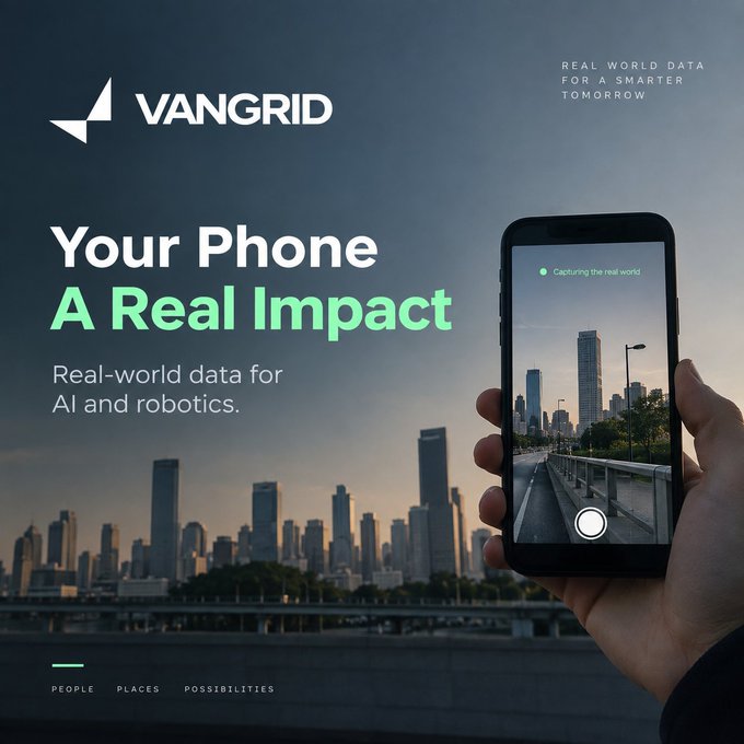 A promotional advertisement for 'VANGRID' featuring the tagline 'Your Phone A Real Impact' and 'REAL WORLD DATA FOR A SMARTER TOMBORROW,' showing a hand using a phone to capture a cityscape.