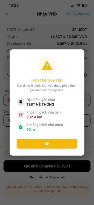 A Vietnamese cryptocurrency app screen showing a USDT to VND conversion with an access restriction warning indicating the nearest test location is 632.4 km away while only 50 m is permitted.